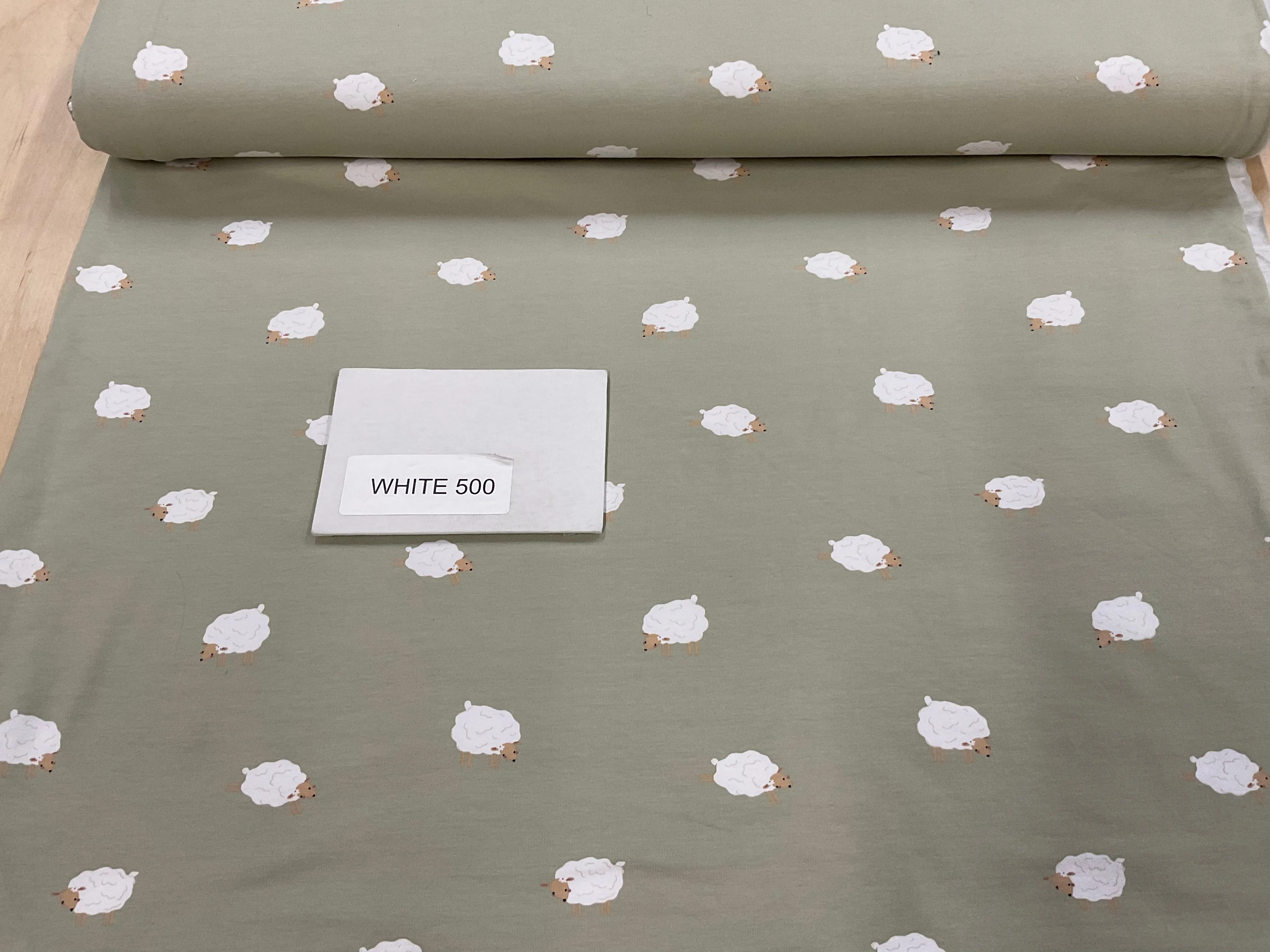 Spring Lambs on Light Khaki Cotton Jersey Fabric